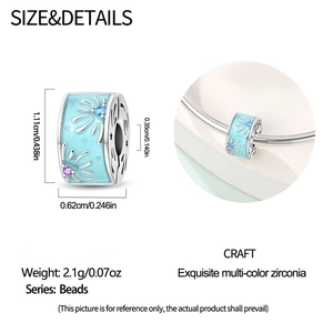 Detail of silver bead charm with blue enamel starburst pattern and exact dimensions