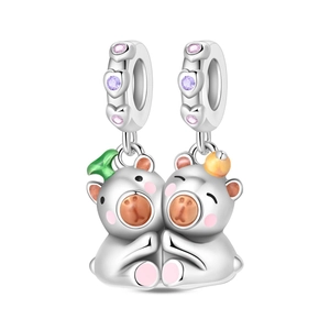 Macro view of S925 sterling silver hugging bear charm with pink and purple zircons