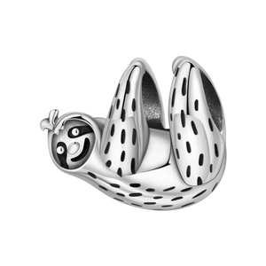 Macro shot of silver sloth animal charm with black enamel details for DIY bracelet