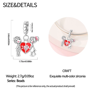 Detailed view of silver charm bead featuring boy, girl and red heart with pink zircon