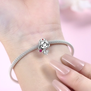 Silver nurse charm bracelet with red heart and cross medical theme jewelry for women