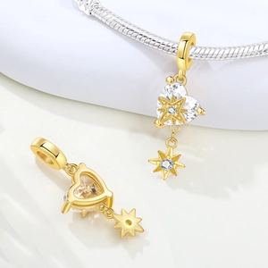 Detail of heart-shaped zircon pendant with gold star overlay on silver snake chain