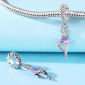 Detail of silver ballet girl charms with purple glitter skirts for DIY charm bracelets