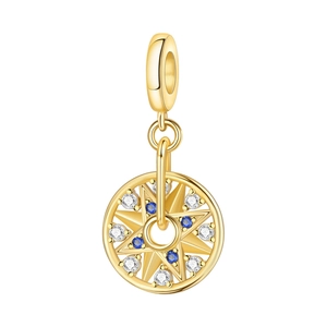 Close-up of golden octagonal star charm with blue and white crystals for bracelets
