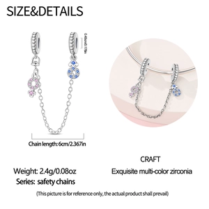 Silver safety chain charm with pink and blue zircon gender symbols and heart motifs