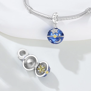 Celestial blue enamel moon and star charm pendant with hidden yellow star inside