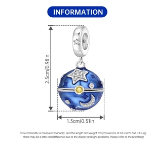 Detail view of a blue enamel star and moon charm with silver plating and cubic zirconia