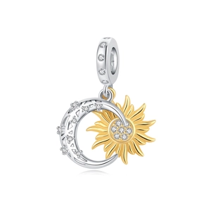 Detail of moon and sun charm with sparkling cubic zirconia in silver and gold finish