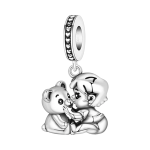 Silver boy kissing teddy bear charm detail with embossed heart patterns on side