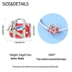 Detailed view of red suitcase charm with travel engraving and dimensions for jewelry making