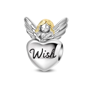 Macro detail of heart charm with Wish engraving and golden angel wing in silver