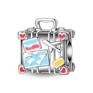Detailed view of silver suitcase charm with red enamel heart and airplane for DIY bracelets