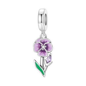Detailed macro of silver pansy charm with purple enamel petals and green leaf accents