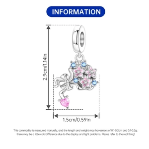 Detailed size view of silver bow charm with pink enamel stars and heart gemstone