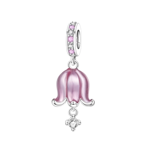 Macro detail of lily of the valley charm with pink enamel and sparkling crystals