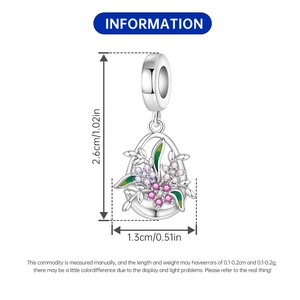 Detail of iris flower charm with purple zircon and dimensions of 2.6cm by 1.3cm