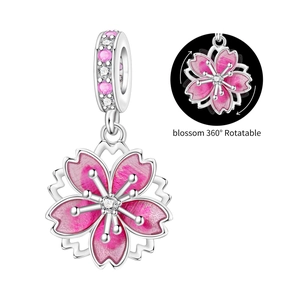 Detailed cherry blossom charm featuring 360-degree rotation and pink enamel petals
