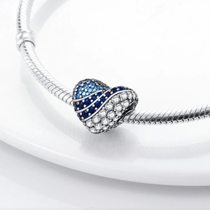Silver heart charm with blue pavé crystals on a classic snake chain bracelet