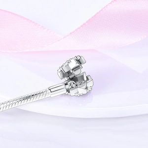 Detail of S925 sterling silver snake chain clasp with sparkling snowflake zircon crystals