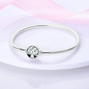 Silver snake chain bracelet featuring a Tree of Life clasp with green and white zirconia