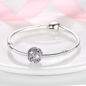 Silver snake chain bracelet featuring infinity heart charm with pink and white cubic zirconia