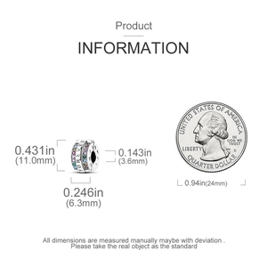 Detail of silver heart charm with Forever engraving and multi-color stones next to coin