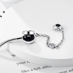Macro shot of S925 silver turtle safety chain charm with detailed engraved shell texture