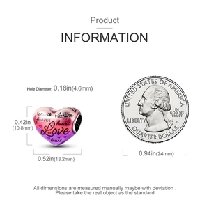 Detailed sizing of heart charm with Love engraving next to a quarter coin for scale