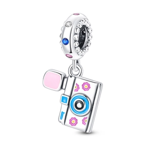 Macro detail of camera charm with pink enamel flowers and multicolored zircon stones