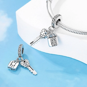 Silver heart lock and key charm with Lock Love engraving and sparkling zircons