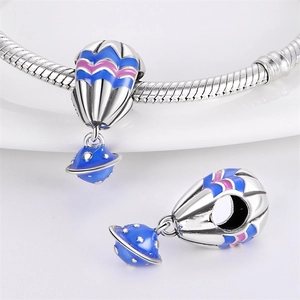 Silver-plated blue hot air balloon and planet charm pendant on a sleek snake chain