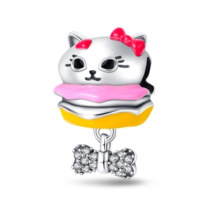 Macro shot of silver cat burger charm with pink enamel and sparkling zircon bow detail