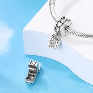 Silver heart lock charm with white zircons on a snake chain bracelet for DIY jewelry