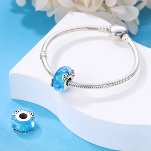 Silver snake chain bracelet featuring blue glass charms with Family and Love you engraving
