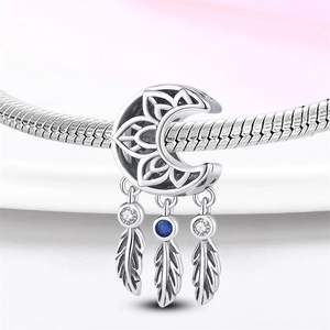 Silver crescent moon charm with hollow lotus pattern and feather tassels for bracelets
