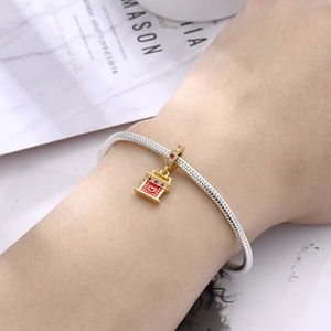 Macro di bracciale serpente argento con ciondolo padiglione smalto rosso e cristalli
