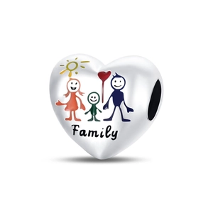 Macro detail of heart-shaped family charm with colorful graphics and Family engraving