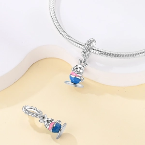 Detailed view of an S925 silver rabbit in teacup charm with pink and blue enamel