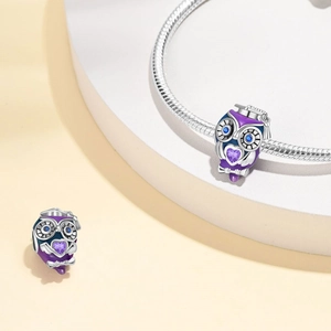 Silver graduation owl charm with purple enamel and heart gemstone on snake chain