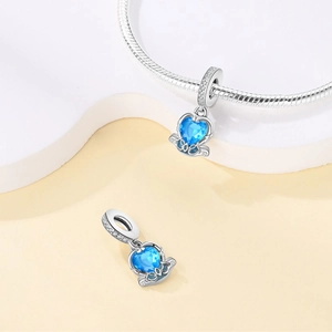Sparkling blue heart crystal pendant charm on a classic silver snake chain necklace