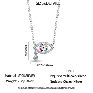 Macro detail of S925 silver Evil Eye pendant with Hamsa charm and zircons