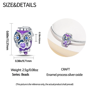 Macro detail of silver owl graduation charm showing exact size and enamel craftsmanship