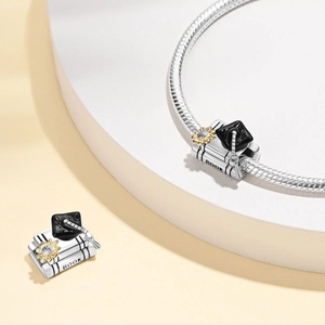 Silver graduation owl charm with book and doctoral cap on a classic snake chain bracelet