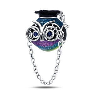 Detailed view of graduation owl charm with blue enamel, mortarboard and glasses