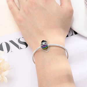Detailed shot of silver graduation owl charm with mortarboard on snake chain bracelet
