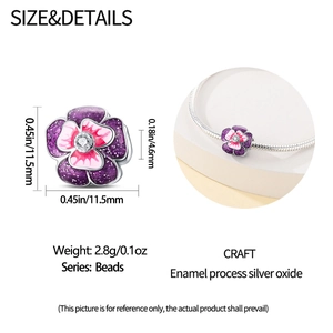 Macro view of pansy charm with purple enamel and zircon inlay on a silver snake chain