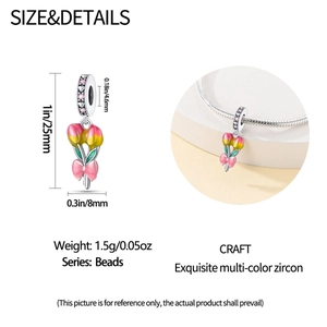 Detailed view of silver tulip floral charm with pink zircon and butterfly bow accents