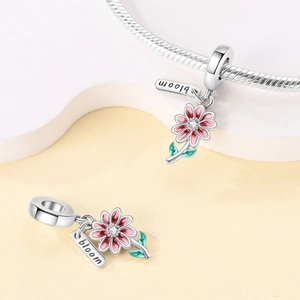 Floral S925 silver charm with red enamel petals, clear zircon, and 'bloom' engraved tag