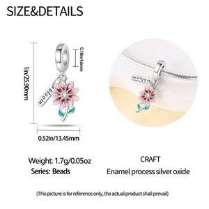 Macro detail of silver floral bead with pink enamel petals and bloom charm on bracelet