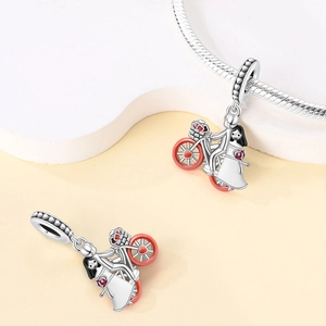 Silver S925 charm with a romantic cycling couple design and heart-shaped wheels